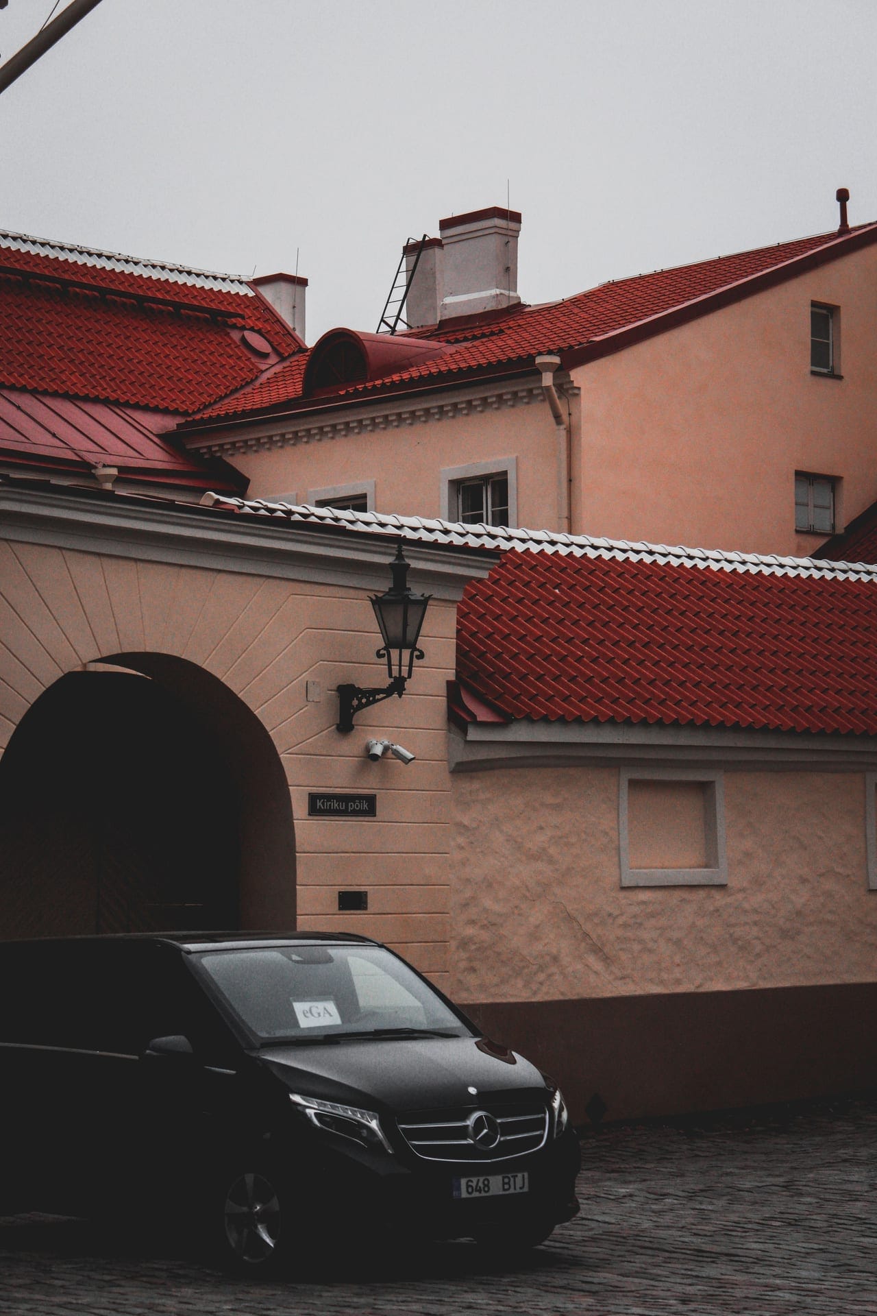Black Mercedes-Benz van in an old town street