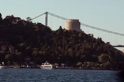 View of Rumeli Fortress with the Bosphorus Bridge in Istanbul during the day.