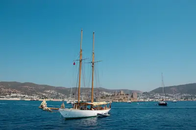 Stunning view of Bodrum Castle in Turkey with sailboats on a clear summer day.